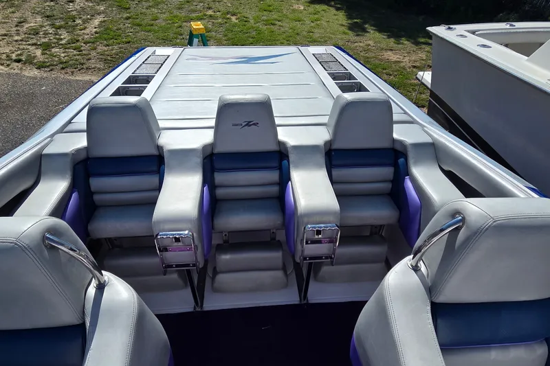 Slide: The Image of 2006 Donzi 38 ZR boat interior with sleek seating and modern design. - 31
