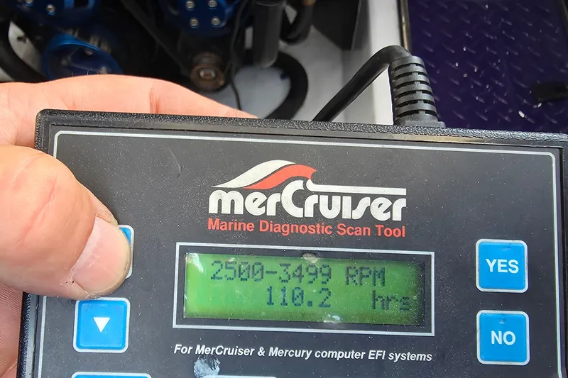 Slide: The Image of MerCruiser diagnostic tool displaying RPM and hours for 2006 Donzi 38 ZR boat. - 18