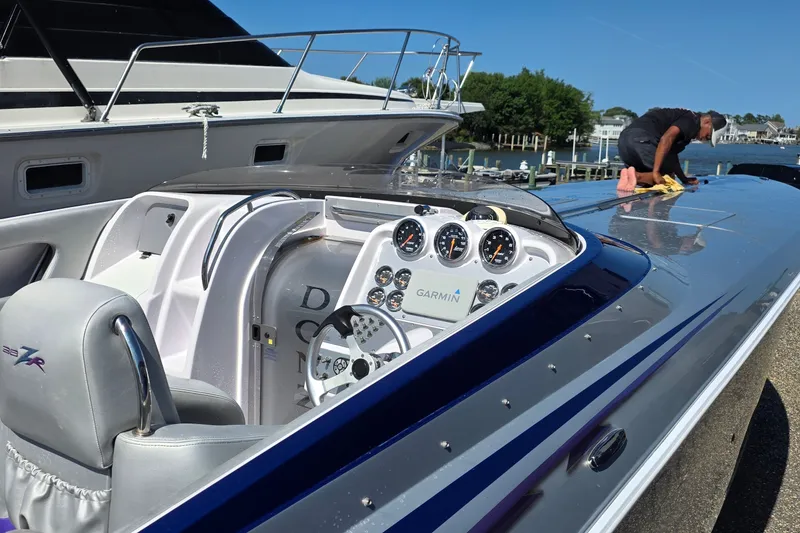 Slide: The Image of 2006 Donzi 38 ZR speedboat with polished deck and detailed cockpit gauges. - 1