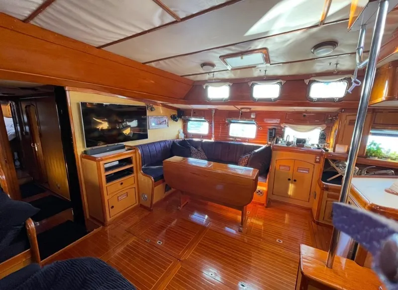 Slide: The Image of 1981 Little Harbor Cruiser interior with wood finish, cozy seating, and modern amenities. - 8