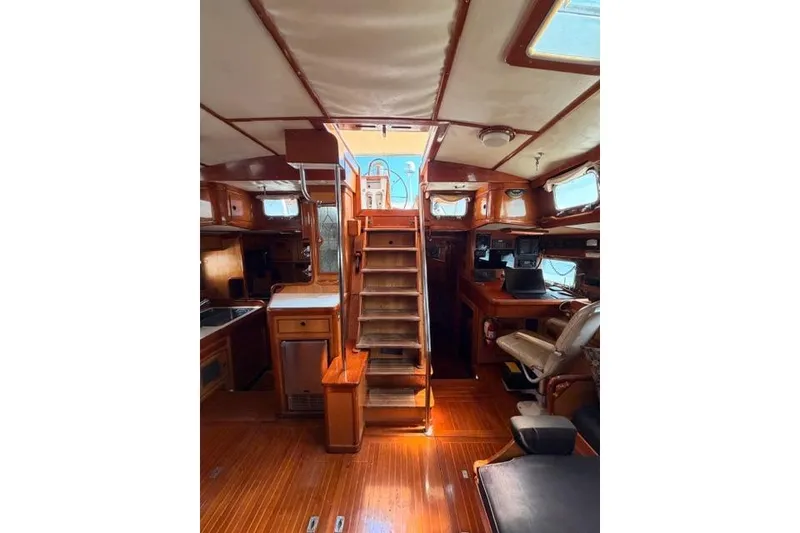 Slide: The Image of Interior of 1981 Little Harbor custom sailboat with wooden finishes and staircase. - 7