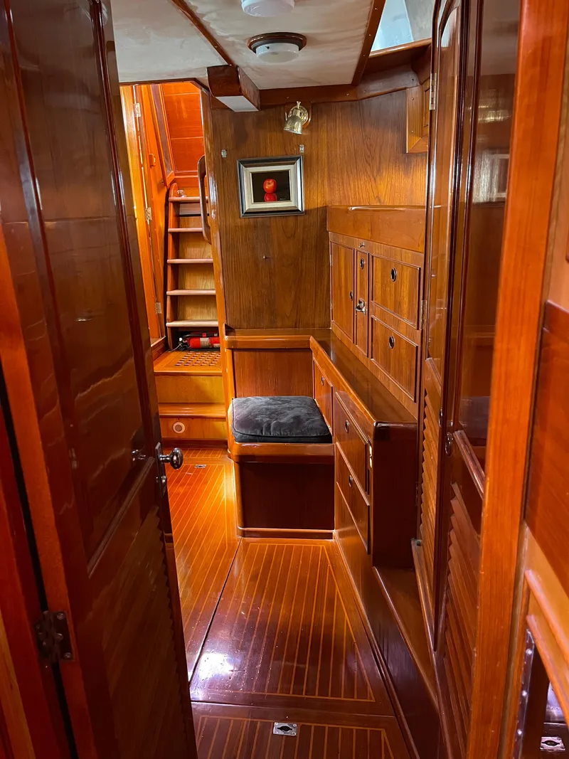 Slide: The Image of 1981 Little Harbor Cruiser interior with polished wood finish and cozy seating area. - 9