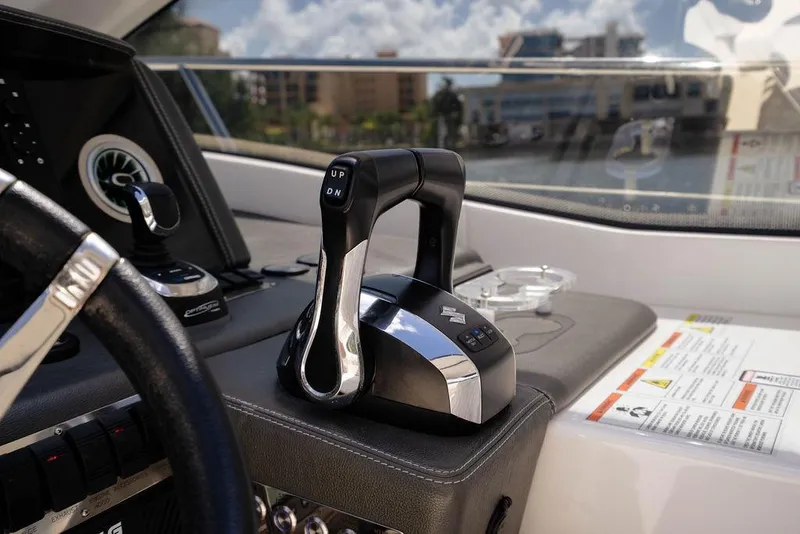 Slide: The Image of Control panel of 2022 Schaefer 400 Sport yacht with throttle levers and steering wheel. - 42