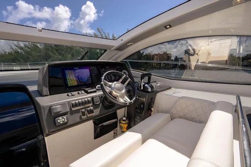 Slide: The Image of Interior of 2022 Schaefer 400 Sport yacht with modern dashboard and steering wheel. - 38