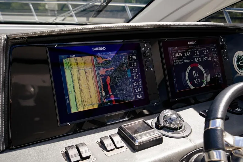 Slide: The Image of Dashboard of 2022 Schaefer 400 Sport with Simrad navigation displays. - 40
