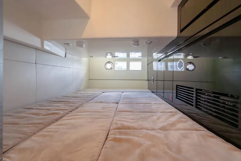 Slide: The Image of Interior cabin of 2022 Schaefer 400 Sport yacht, featuring a cozy sleeping area. - 60