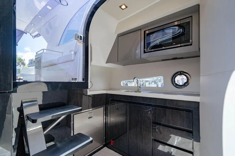 Slide: The Image of Modern kitchen interior of 2022 Schaefer 400 Sport yacht with sleek cabinetry and appliances. - 53