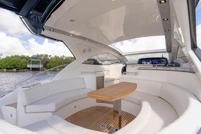 Slide: The Image of Luxurious 2022 Schaefer 400 Sport yacht interior with elegant seating and wooden table. - 33