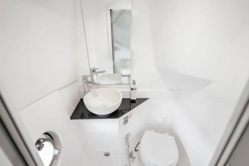 Slide: The Image of Modern bathroom in 2022 Schaefer 400 Sport yacht with sleek sink and toilet. - 62
