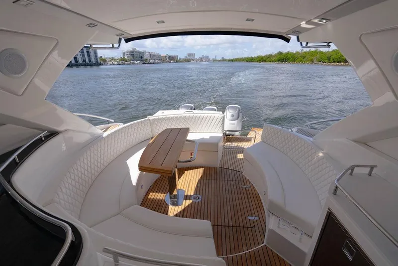 Slide: The Image of Luxurious 2022 Schaefer 400 Sport yacht interior with elegant seating and scenic water view. - 23