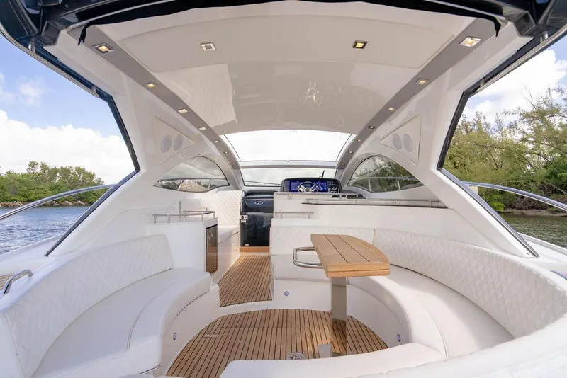 Slide: The Image of Luxurious interior of 2022 Schaefer 400 Sport yacht with elegant seating and wooden table. - 32