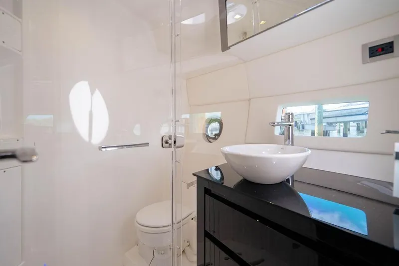 Slide: The Image of Luxurious bathroom interior of 2022 Schaefer 400 Sport yacht with modern fixtures. - 68