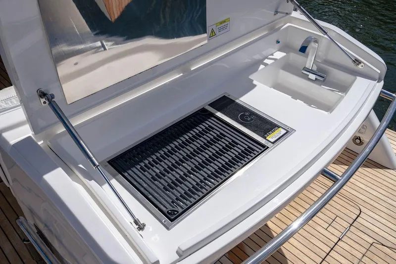 Slide: The Image of Outdoor grill and sink on 2022 Schaefer 400 Sport yacht deck. - 28