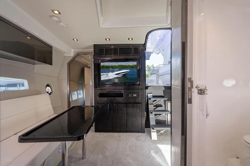 Slide: The Image of Interior of 2022 Schaefer 400 Sport yacht with modern seating and entertainment system. - 51