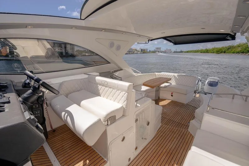 Slide: The Image of Luxurious 2022 Schaefer 400 Sport yacht interior with elegant seating and scenic water view. - 44
