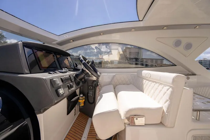 Slide: The Image of Interior of 2022 Schaefer 400 Sport yacht with luxurious seating and modern dashboard. - 43