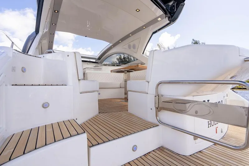 Slide: The Image of 2022 Schaefer 400 Sport yacht interior with sleek seating and wooden flooring. - 31