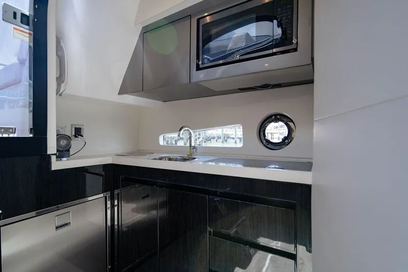 Slide: The Image of Modern kitchen interior of 2022 Schaefer 400 Sport yacht with sleek cabinetry and appliances. - 56