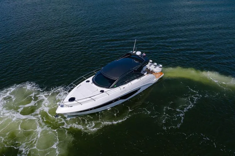 Slide: The Image of 2022 Schaefer 400 Sport yacht cruising on open water, aerial view. - 7