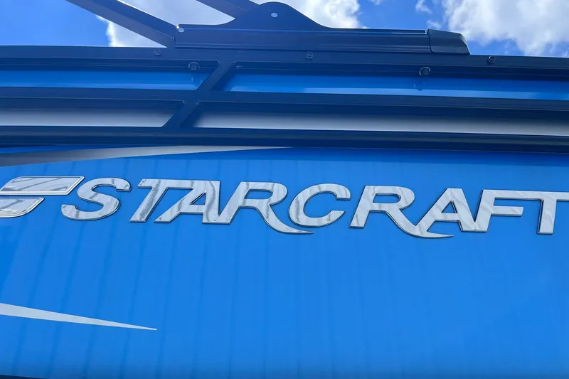 Slide: The Image of 2024 Starcraft SLS 3 logo on blue background with sky reflection. - 41