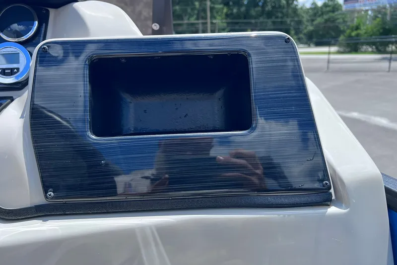 Slide: The Image of Dashboard compartment of 2024 Starcraft SLS 3 boat, featuring sleek design and reflective surface. - 20