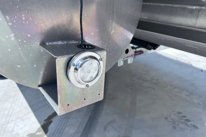 Slide: The Image of Close-up of a 2024 Starcraft SLS 3 boat component with a mounted light fixture. - 38