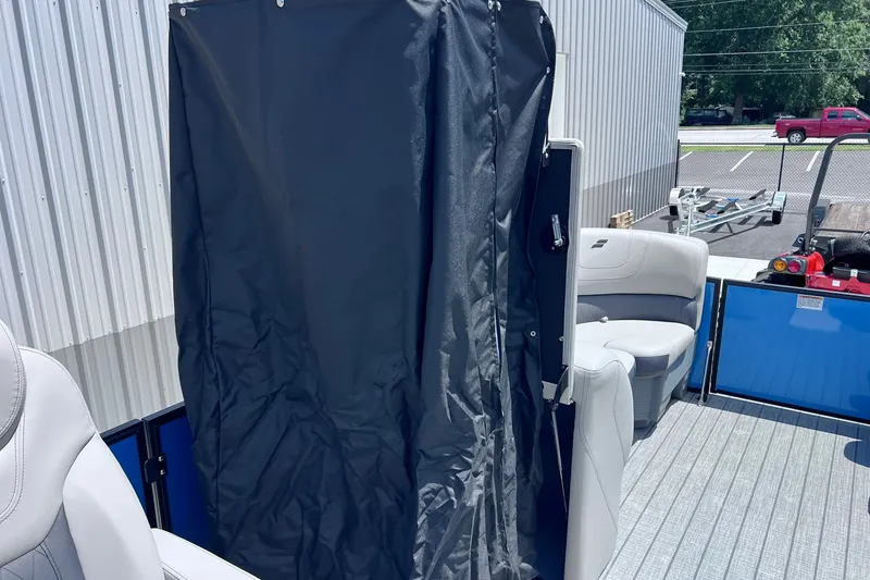 Slide: The Image of 2024 Starcraft SLS 3 boat interior with seating and privacy curtain. - 30