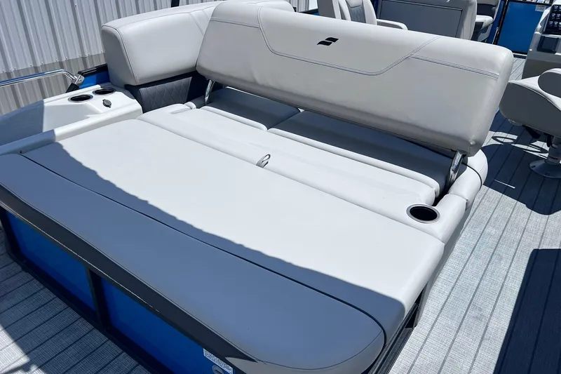 Slide: The Image of 2024 Starcraft SLS 3 boat with luxurious seating and cup holders. - 16
