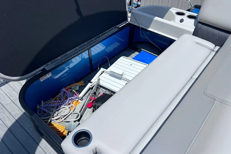 Slide: The Image of Open storage compartment on 2024 Starcraft SLS 3 boat, containing ropes and equipment. - 36