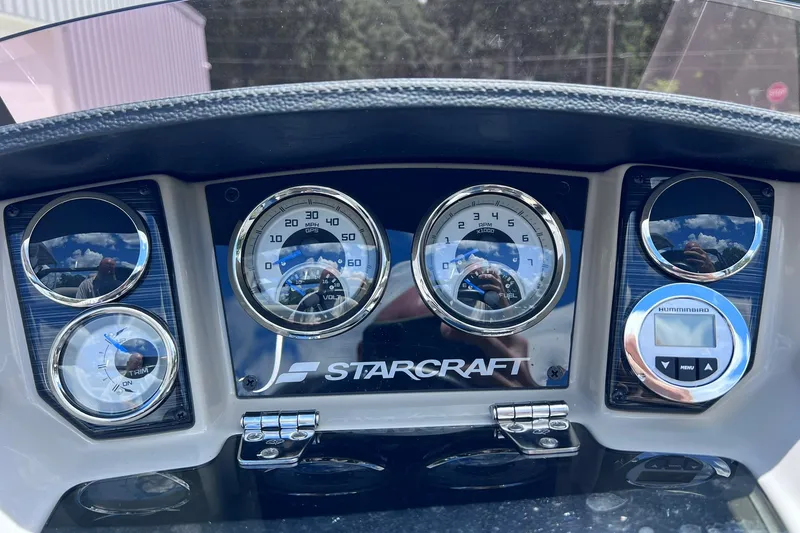 Slide: The Image of Dashboard of 2024 Starcraft SLS 3 boat with gauges and controls. - 19