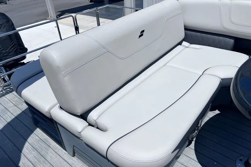 Slide: The Image of 2024 Starcraft SLS 3 boat with luxurious white seating and sleek design. - 14