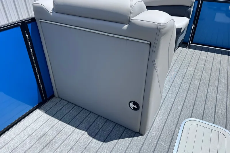 Slide: The Image of 2024 Starcraft SLS 3 boat interior with gray seating and blue panel accents. - 28