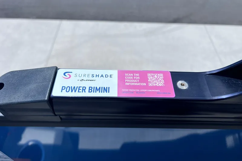 Slide: The Image of SureShade Power Bimini label on Starcraft SLS 3, 2024 model, with QR code for product info. - 33