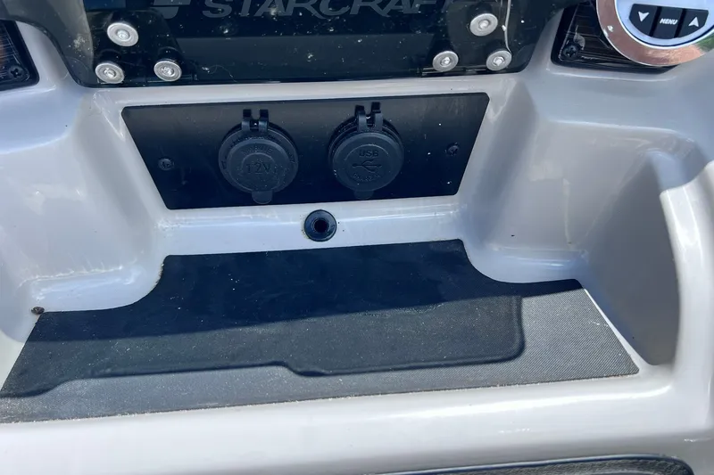 Slide: The Image of 2024 Starcraft SLS 3 dashboard with 12V and USB ports. - 25