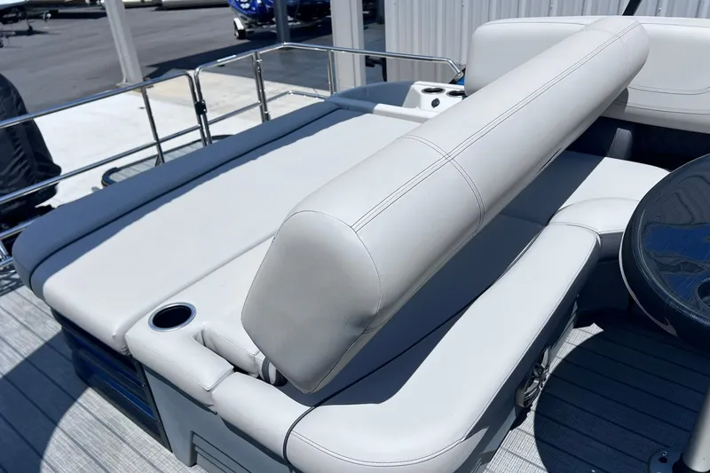Slide: The Image of 2024 Starcraft SLS 3 boat interior with white seating and cup holder. - 15