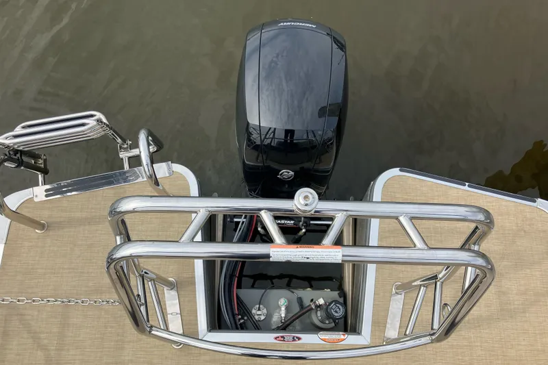 Slide: The Image of 2024 Harris Cruiser 230 boat with Mercury outboard motor and stainless steel railing. - 8