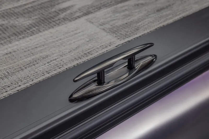 Slide: The Image of 2026 Tahoe Pontoon Grand Tahoe Elite Windshield 25 cleat detail on textured deck. - 16