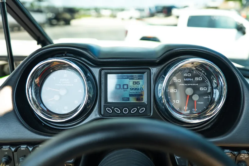 Slide: The Image of Dashboard of a 2015 Moomba Mojo boat showing speedometer and RPM gauges. - 26