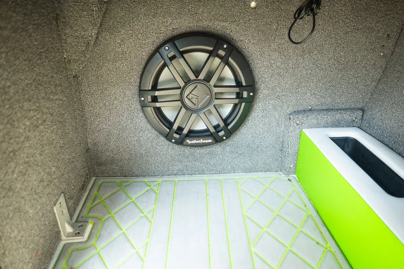 Slide: The Image of 2015 Moomba Mojo interior with Rockford Fosgate speaker and green-accented flooring. - 29