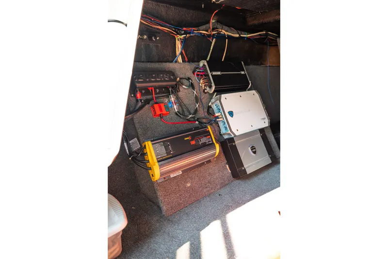 Slide: The Image of 2015 Moomba Mojo boat interior showing electronic components and wiring setup. - 30