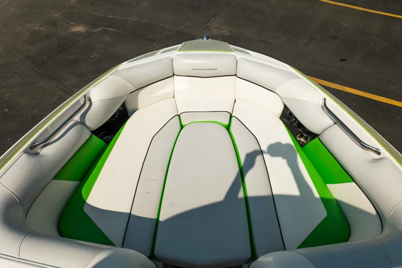 Slide: The Image of Interior of 2015 Moomba Mojo boat with white and green seating. - 34