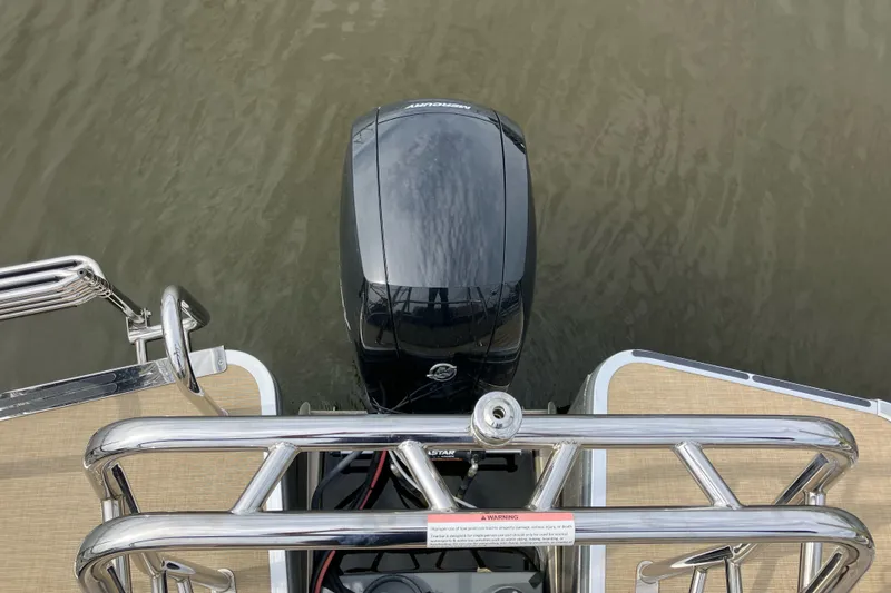 Slide: The Image of 2024 Harris Cruiser 230 boat with outboard motor, viewed from above on water. - 7