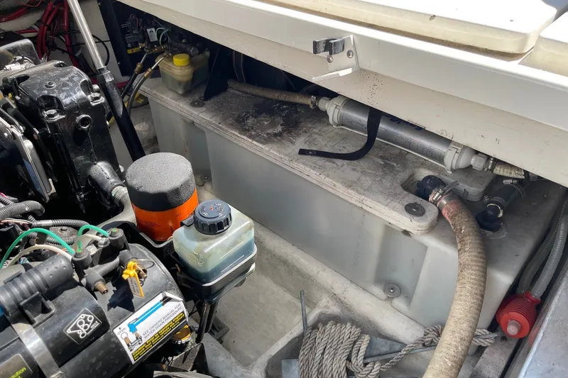 Slide: The Image of Engine compartment of a 2007 Bayliner Discovery 288 boat, showing various mechanical components. - 26