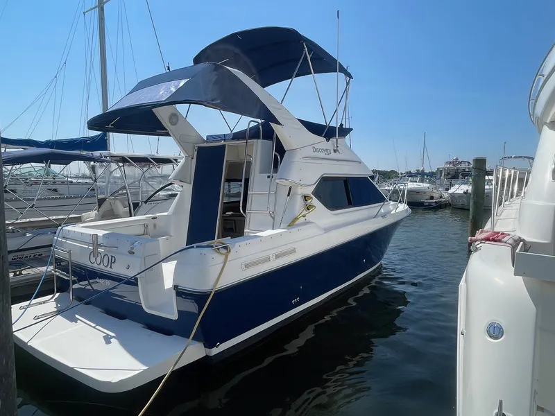 Slide: The Image of 2007 Bayliner Discovery 288 docked at a marina. - 4