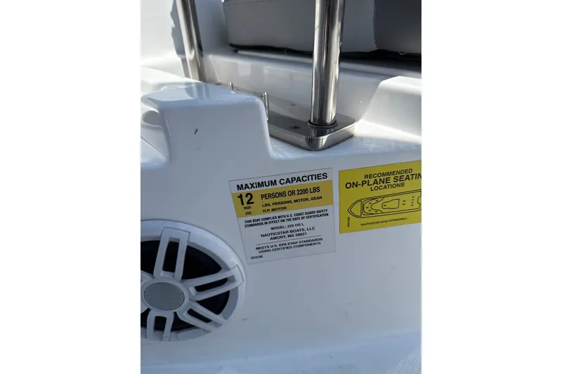 Slide: The Image of 2024 NauticStar 222L Offshore boat capacity label, seating recommendations, and speaker detail. - 7
