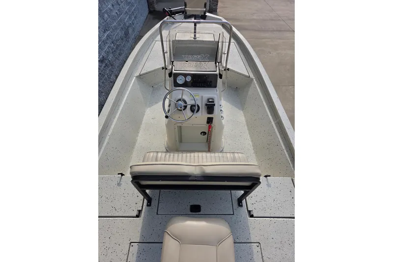 Slide: The Image of 2014 Xpress H22 Bay boat interior with steering console and seating. - 5