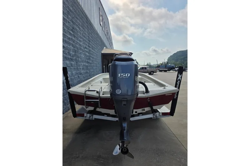 Slide: The Image of 2014 Xpress H22 Bay boat with Yamaha 150 engine on trailer. - 4