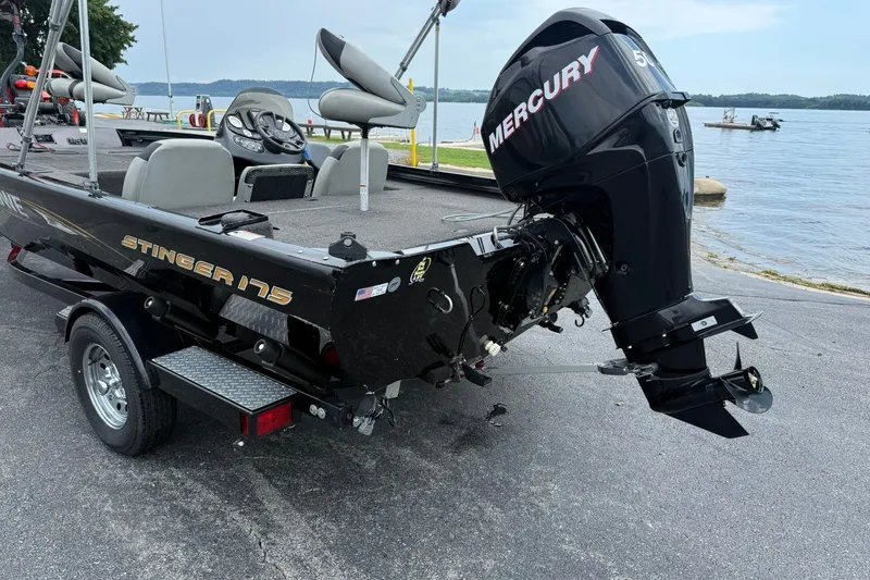 Slide: The Image of 2014 Lowe Stinger 175 boat with Mercury outboard motor by a lake. - 3