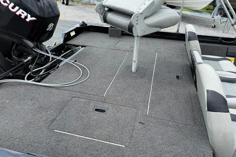 Slide: The Image of 2014 Lowe Stinger 175 boat interior with Mercury engine and seating. - 12