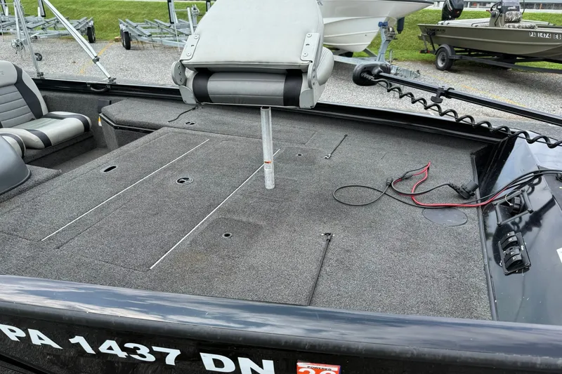 Slide: The Image of 2014 Lowe Stinger 175 boat interior with seating and fishing deck. - 8